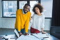 smiling african american businesspeople looking