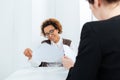 Smiling african american businesswoman having job interview and filling application Royalty Free Stock Photo