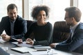 Smiling African American businesswoman speaking at corporate meeting Royalty Free Stock Photo