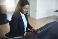 Smiling African American businesswoman working in her office Royalty Free Stock Photo