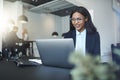 Smiling African American businesswoman working online at her off Royalty Free Stock Photo