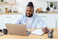 smiling African American confident businessman using laptop computer Remote work concept Royalty Free Stock Photo