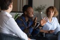 Smiling African American employee speaking at corporate meeting in office Royalty Free Stock Photo