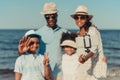 smiling african american family with two kids taking selfie with smartphone Royalty Free Stock Photo