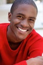 Smiling african american guy in red sweater Royalty Free Stock Photo