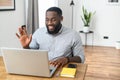 Smiling African American guy on video conference Royalty Free Stock Photo