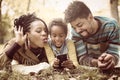 African American little girl taking self picture in park Royalty Free Stock Photo