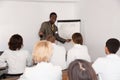 Smiling African American male professor giving presentation for medics