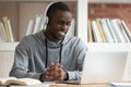 Smiling black male watch online training course at laptop Royalty Free Stock Photo