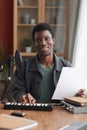 Smiling African-American Man Making Music at Home Royalty Free Stock Photo