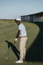 Smiling african american man playing golf on golf course Royalty Free Stock Photo