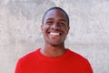 Smiling african american man in red sweater Royalty Free Stock Photo