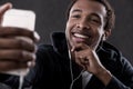 Smiling African American man taking self portrait Royalty Free Stock Photo