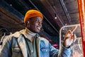 African-American man uses self-service kiosk to order snack Royalty Free Stock Photo