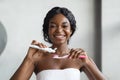 Smiling african american lady with toothbrush and toothpaste Royalty Free Stock Photo