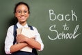 African american schoolgirl with books near