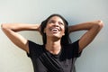 Smiling african american woman with hands behind head Royalty Free Stock Photo