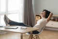 Smiling African American woman in headphones relaxing at home Royalty Free Stock Photo