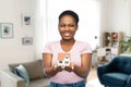 smiling african american woman holding house model Royalty Free Stock Photo