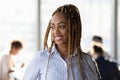 Smiling African American woman look in distance thinking Royalty Free Stock Photo