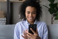 Smiling African American woman talk on video call on cell Royalty Free Stock Photo