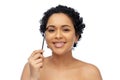 smiling african american woman with mascara brush Royalty Free Stock Photo