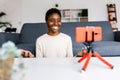 Smiling african american woman recording video on her mobile phone Royalty Free Stock Photo