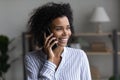 Smiling African American woman talk on cellphone Royalty Free Stock Photo