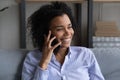 Smiling African American woman talk on cellphone Royalty Free Stock Photo