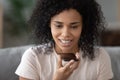 Smiling African American woman using phone, recording voice message Royalty Free Stock Photo