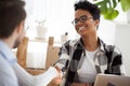 Smiling black female handshake colleague at office meeting Royalty Free Stock Photo