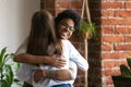 Smiling African American woman embrace with female friend Royalty Free Stock Photo