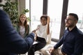 Smiling African American woman asking question to mentor at meeting Royalty Free Stock Photo