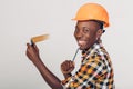 African-American builder uses measuring tape