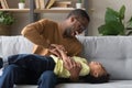 Happy african American dad laughing playing with son at home Royalty Free Stock Photo