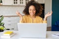 Young African-American woman using laptop at home Royalty Free Stock Photo
