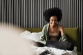 Smiling african american young woman using laptop Royalty Free Stock Photo