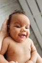 Smiling african baby, top view, mother pov Royalty Free Stock Photo