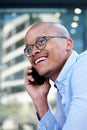 Smiling african businessman talking with cell phone Royalty Free Stock Photo