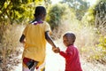 Smiling African Children Walking Outdoors in Typical Tribal Town Near Bamako, Mali Africa