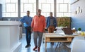 Smiling African coworkers taking a break in a modern office