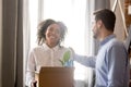 Smiling african employee excited about boss welcoming on first d