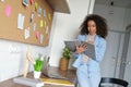 Smiling african female college student studying from home holding notebook. Royalty Free Stock Photo