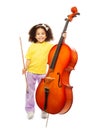 Smiling African girl holding cello and fiddlestick Royalty Free Stock Photo