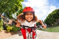 Smiling African girl riding her bicycle in summer Royalty Free Stock Photo