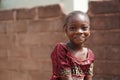 Smiling African Girl With a Wet Face After Having Taken A Sip From The Water Borehole Royalty Free Stock Photo