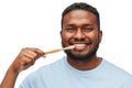 Smiling african man with toothbrush cleaning teeth Royalty Free Stock Photo