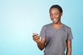 Smiling african man using smartphone Royalty Free Stock Photo