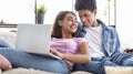 Smiling african teenagers using laptop together at home Royalty Free Stock Photo