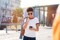 African girl using smartphone on road